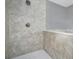 Elegant bathroom shower featuring decorative tile and sleek fixtures at 1159 Fair Sw St, Atlanta, GA 30314