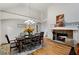 Dining room with hardwood floors and a stone fireplace at 216 Crescent Moon Way, Canton, GA 30114