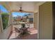 Inviting covered porch with ceiling fan and view of landscaped front yard at 216 Crescent Moon Way, Canton, GA 30114