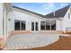 Spacious stone backyard patio perfect for outdoor entertaining and relaxation at 5225 Ginger Rose Ct, Cumming, GA 30028