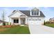 Charming new construction home with a two-car garage and well-manicured lawn at 5225 Ginger Rose Ct, Cumming, GA 30028