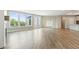 Spacious living room featuring hardwood floors, ample natural light, and neutral paint at 5225 Ginger Rose Ct, Cumming, GA 30028