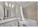 Bathroom featuring a shower/tub combination, granite vanity, and updated lighting fixtures at 2867 Darlington Run, Duluth, GA 30097