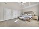 Bright bedroom with a vaulted ceiling, paneled ceiling, and a mirrored king bed set at 2867 Darlington Run, Duluth, GA 30097