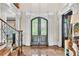 Elegant entryway with decorative glass doors, marble floors, and classic architectural details at 2867 Darlington Run, Duluth, GA 30097