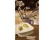 Elegant display featuring a vibrant arrangement of flowers and a delectable food item plated on a clean, square dish at 2867 Darlington Run, Duluth, GA 30097