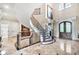 Spacious foyer with grand staircase, marble floors, and access to various rooms at 2867 Darlington Run, Duluth, GA 30097