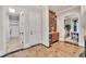 Inviting hallway with elegant marble flooring, a built-in bar, and access to other rooms at 2867 Darlington Run, Duluth, GA 30097