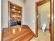 Hallway with wooden stairs leading to a home theater and a bathroom at 2867 Darlington Run, Duluth, GA 30097