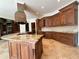Gourmet kitchen with stainless steel appliances, custom cabinetry, and granite countertops on a large island at 2867 Darlington Run, Duluth, GA 30097