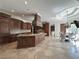 Spacious kitchen features custom cabinets, granite countertops, tile flooring, and a breakfast nook at 2867 Darlington Run, Duluth, GA 30097