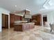Gourmet kitchen boasts custom cabinetry, granite countertops, and a large center island perfect for entertaining at 2867 Darlington Run, Duluth, GA 30097