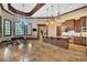 Open concept kitchen and dining area featuring a large island and stainless steel appliances at 2867 Darlington Run, Duluth, GA 30097