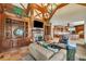 Spacious living room with wood finishes, fireplace, built-in shelving, and view of the kitchen at 2867 Darlington Run, Duluth, GA 30097