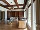 Elegant living room with coffered ceilings, hardwood floors, custom built-ins, and natural light at 2867 Darlington Run, Duluth, GA 30097