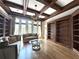 Elegant living room featuring custom built-ins, hardwood floors, and lots of natural light at 2867 Darlington Run, Duluth, GA 30097