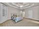 Large carpeted main bedroom with ceiling fan, built-in shelving, and neutral decor at 2867 Darlington Run, Duluth, GA 30097