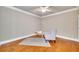 Cozy home office with hardwood floors, featuring a comfortable chair and ample natural light at 2867 Darlington Run, Duluth, GA 30097