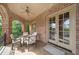 Charming brick patio with covered seating area, offering a view and outdoor dining space at 2867 Darlington Run, Duluth, GA 30097