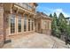 Outdoor patio with brick exterior, offering panoramic views and ample space for entertaining at 2867 Darlington Run, Duluth, GA 30097