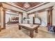 Elegant pool room with coffered ceilings, columns, and staircase access at 2867 Darlington Run, Duluth, GA 30097