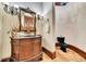 Classic powder room with ornate vanity, decorative mirror, and elegant fixtures at 2867 Darlington Run, Duluth, GA 30097