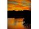 Scenic sunset view over the lake with colorful sky and reflections on the water for a tranquil community setting at 2867 Darlington Run, Duluth, GA 30097