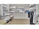 Walk-in closet featuring built-in shelving and ample storage space for organization at 2867 Darlington Run, Duluth, GA 30097