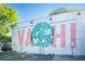 Bright neighborhood mural 'Welcome to the Va-Hi' with colorful graphics and a positive message at 1277 Avalon Ne Pl, Atlanta, GA 30306