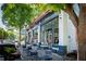 A neighborhood corner store in Virginia-Highland features outdoor seating, a red awning and welcoming signage at 1277 Avalon Ne Pl, Atlanta, GA 30306