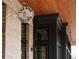 Close-up of a 'Los Rios Cantina' sign adorning a brick building with dark wood trim at 628 Skytop Dr # 158, Cumming, GA 30040