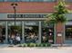 Never Enough Thyme restaurant featuring large windows, exterior seating, and clear signage with surrounding scenery at 628 Skytop Dr # 158, Cumming, GA 30040