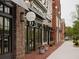 Charming retail storefronts with brick facades, awnings, and inviting sidewalk appeal at 628 Skytop Dr # 158, Cumming, GA 30040