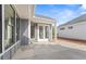 Outdoor patio area with ample space for seating and entertaining, and gray siding on the home at 248 Persimmon Dr, Holly Springs, GA 30115