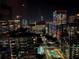 Nighttime aerial view of city skyline with modern high-rise buildings and pools at 1080 Peachtree Ne St # 2512, Atlanta, GA 30309