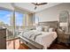 Serene main bedroom with hardwood floors and large windows providing incredible city views at 1080 Peachtree Ne St # 2512, Atlanta, GA 30309