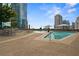 Relaxing community pool with lounge chairs and city views at 1080 Peachtree Ne St # 2512, Atlanta, GA 30309