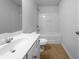 Bright bathroom with a single sink vanity and a bathtub/shower combo, offering essential amenities at 4106 Dahlgreen Way, Decatur, GA 30032