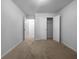 Carpeted bedroom featuring closet space and lots of natural light; a peaceful retreat within the home at 4106 Dahlgreen Way, Decatur, GA 30032