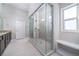 Bathroom featuring a glass enclosed walk-in shower and a bench seat at 1068 W Union Grove Cir, Auburn, GA 30011