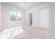 Bedroom featuring plush carpet, a window for natural light, and a closet with a door at 1068 W Union Grove Cir, Auburn, GA 30011