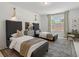 Comfortable bedroom with stylish decor and ample natural light at 689 Dobbs Rd, Woodstock, GA 30188