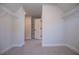 Walk-in closet with wire shelving and access to additional storage at 303 Retreat Way, Carrollton, GA 30116