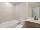 Neutral bathroom features a modern vanity with a rectangular mirror and tiled shower/tub at 111 Henley St, Canton, GA 30114