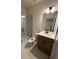 Modern bathroom with a glass shower, toilet and vanity at 111 Henley St, Canton, GA 30114