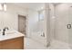 Modern bathroom featuring a double sink vanity, separate tub, and glass-enclosed shower at 111 Henley St, Canton, GA 30114