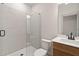 Modern bathroom features a glass-enclosed shower with sleek, large-format tile at 111 Henley St, Canton, GA 30114