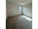 Well-lit bedroom with grey carpet and a window at 111 Henley St, Canton, GA 30114