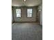 Spacious bedroom with two windows and neutral carpeting at 111 Henley St, Canton, GA 30114