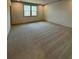 Large bedroom with window and neutral carpeting at 111 Henley St, Canton, GA 30114